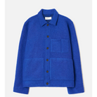 A vibrant royal blue wool-blend jacket with a button-up front, collar, and front pockets, displayed on a clean off-white background.