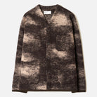A long-sleeve button-front cardigan with a mottled, marbled pattern in dark brown and beige, laid flat against a light off-white background.