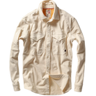 A cream-colored long-sleeve button-up shirt with two chest flap pockets, displayed flat against a solid white background.