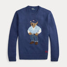 Blue sweater with embroidered bear design on a light gray background